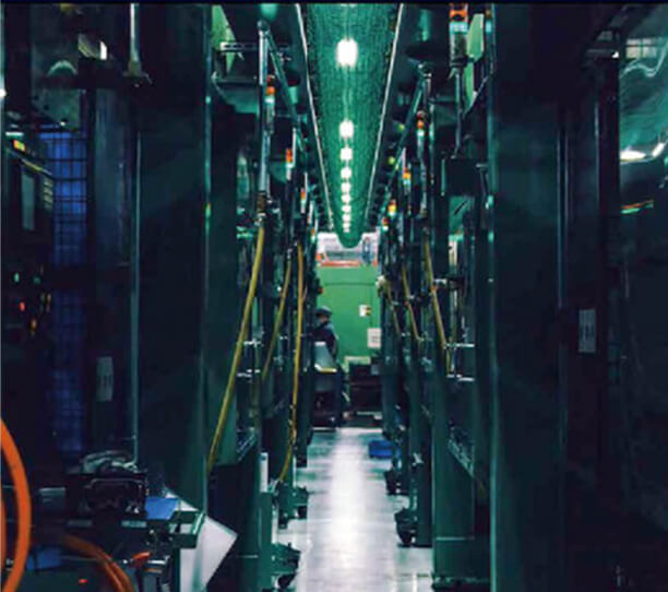 A Modern Automated Factory Assembly Line With Advanced Machinery And Green Lighting